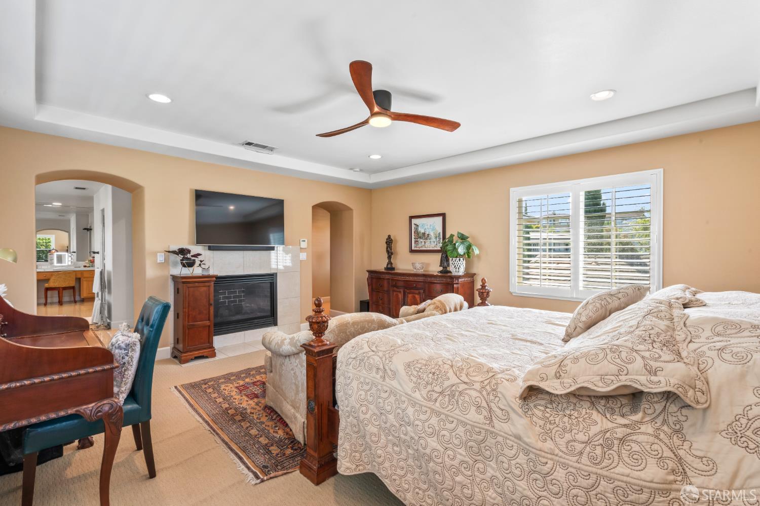 103 Abalone Cove Hercules, CA 94547 - Photo 42 of 84 a bedroom with a bed a chandelier and a flat screen television