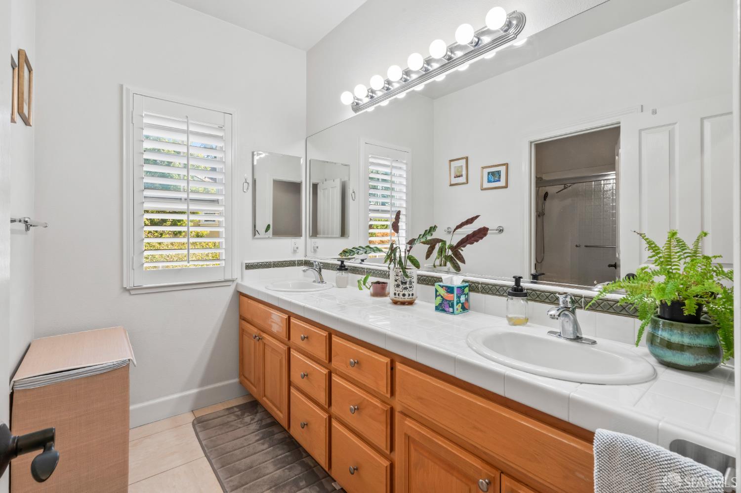 103 Abalone Cove Hercules, CA 94547 - Photo 59 of 84 a bathroom with double vanity and a mirror
