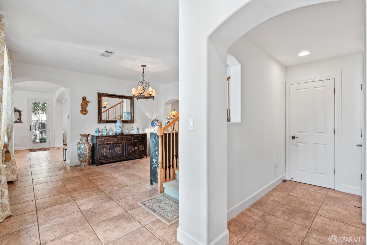 103 Abalone Cove Hercules, CA 94547 - Photo 8 of 84 a view of a hallway with a livingroom and a chandelier