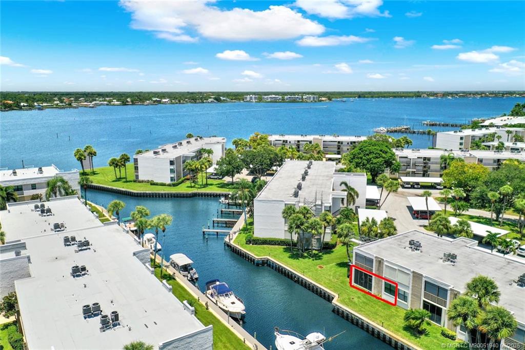 an aerial view of a house with a lake view
