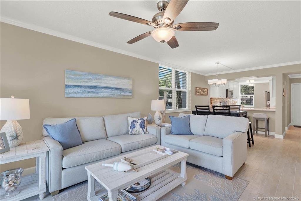 1950 Southwest Palm City Road, Unit 9108 Stuart, FL 34994 - Photo 13 of 37 a living room with furniture and a ceiling fan