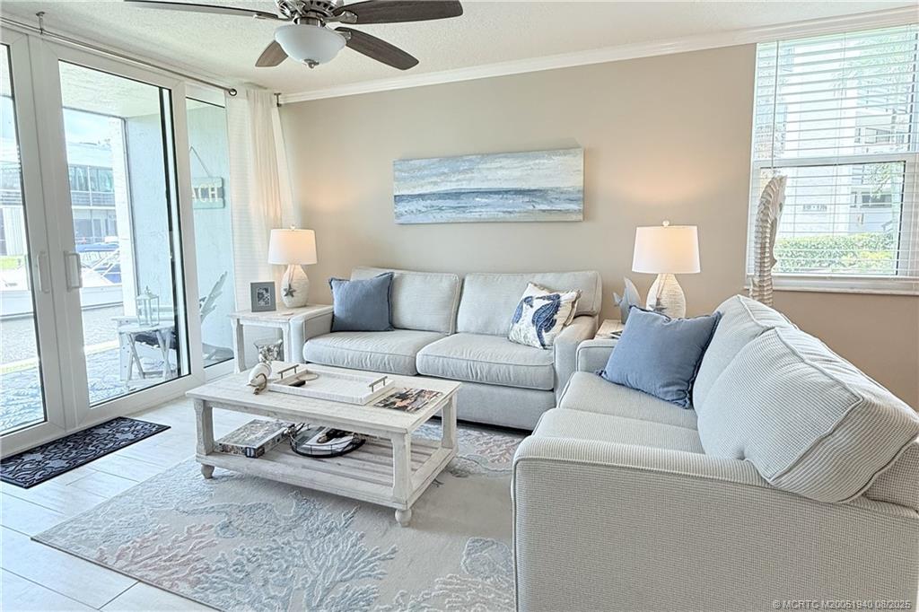 1950 Southwest Palm City Road, Unit 9108 Stuart, FL 34994 - Photo 15 of 37 a living room with furniture and a window