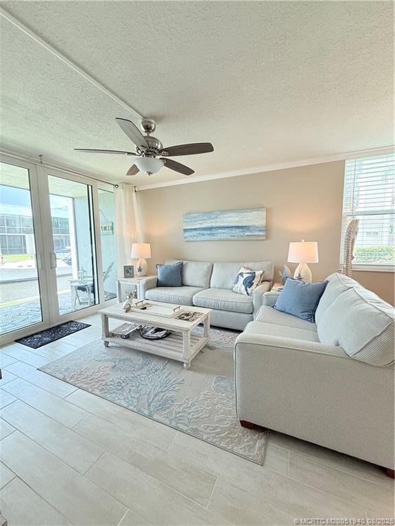 1950 Southwest Palm City Road, Unit 9108 Stuart, FL 34994 - Photo 16 of 37 a living room with furniture and a large window