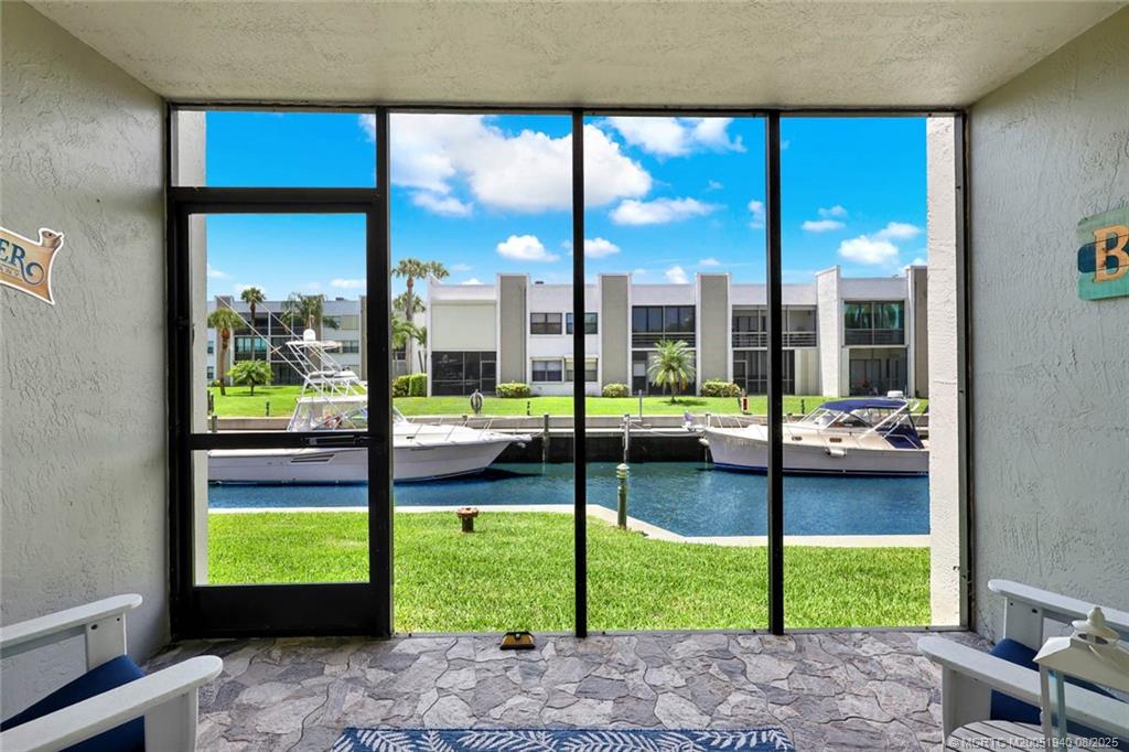 1950 Southwest Palm City Road, Unit 9108 Stuart, FL 34994 - Photo 17 of 37 a view of a porch and patio