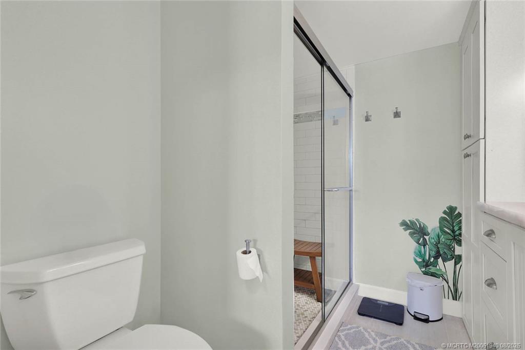 1950 Southwest Palm City Road, Unit 9108 Stuart, FL 34994 - Photo 25 of 37 a bathroom with a toilet and a shower