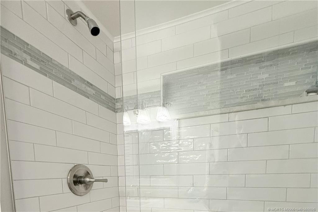 1950 Southwest Palm City Road, Unit 9108 Stuart, FL 34994 - Photo 26 of 37 a bathroom with shower