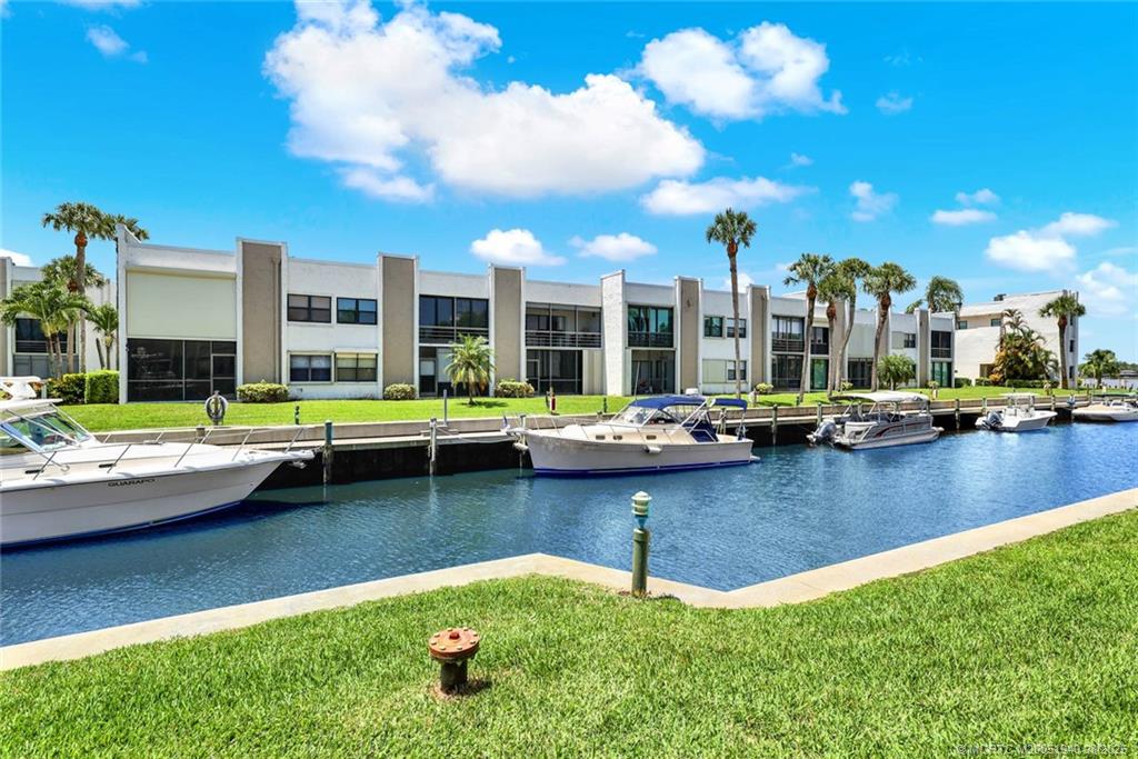1950 Southwest Palm City Road, Unit 9108 Stuart, FL 34994 - Photo 32 of 37 a view of a lake with a house