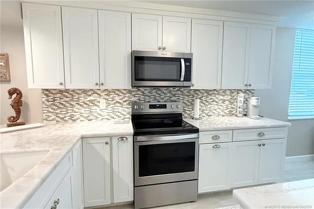a kitchen with a stove and a microwave