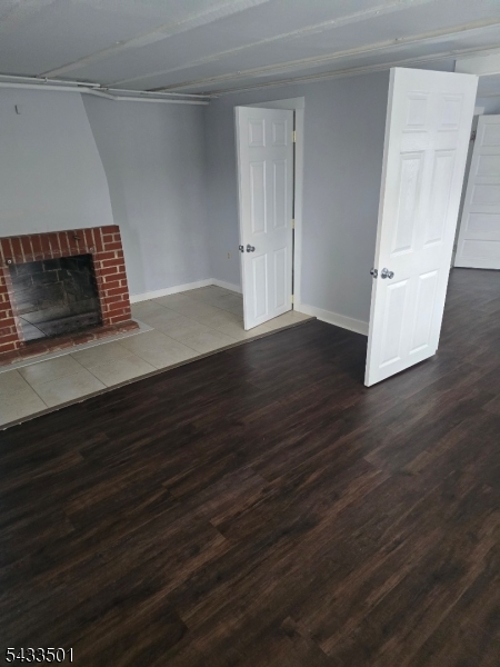 16 Musconetcong River Road, Unit 2 Hampton, NJ 08827 - Photo 10 of 12 a view of empty room with wooden floor and fireplace