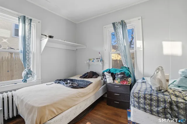 a bedroom with a bed and ceiling fan