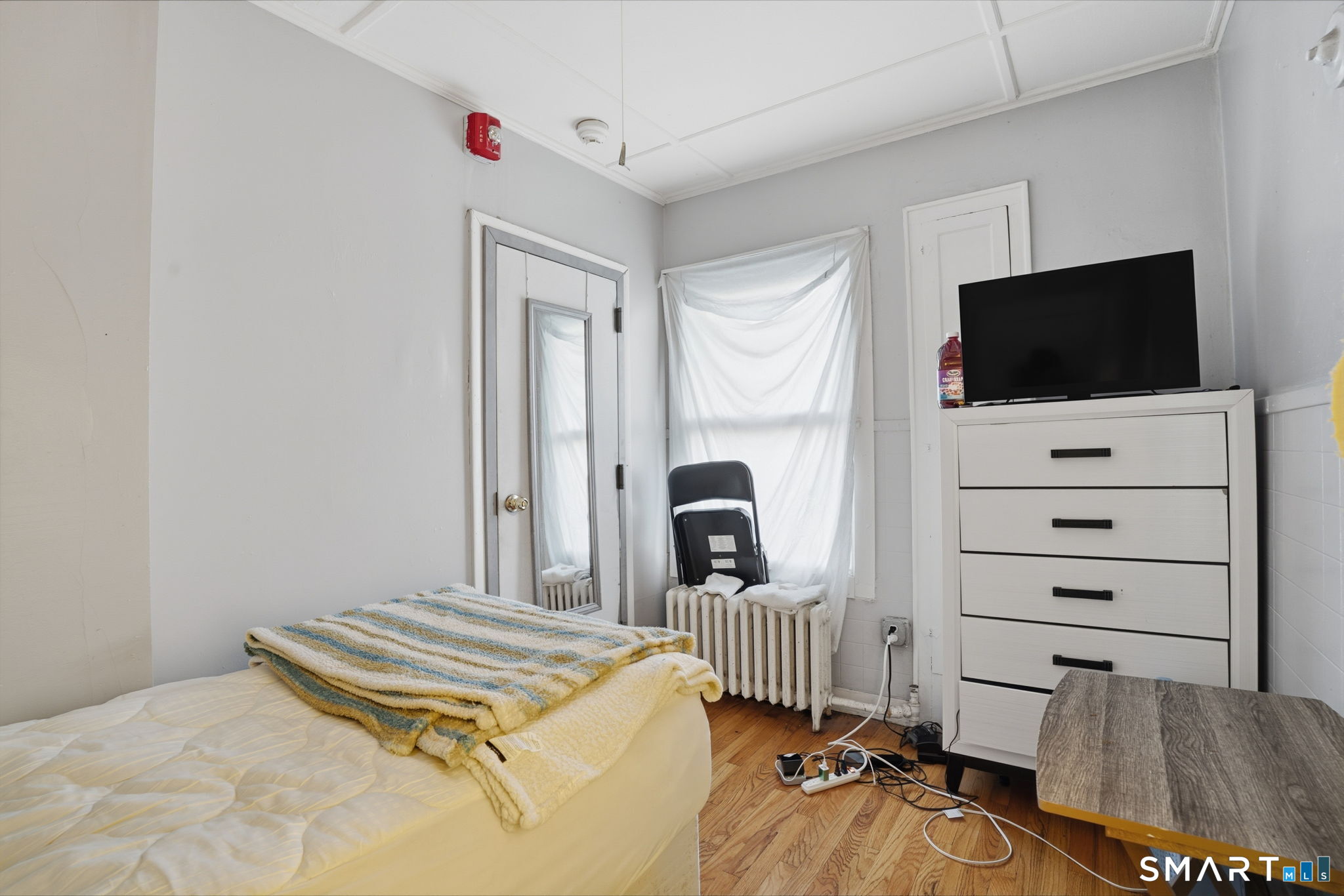 49 Birch Street Manchester, CT 06040 - Photo 17 of 30 a bedroom with a bed and a flat screen tv