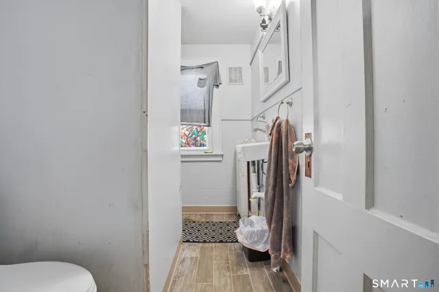 a bedroom with two beds and a large mirror