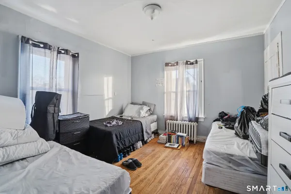 a bedroom with a bed and cabinets