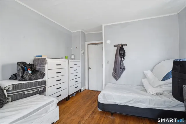 a bedroom with a bed and a dresser