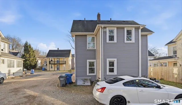 a car parked in front of a house