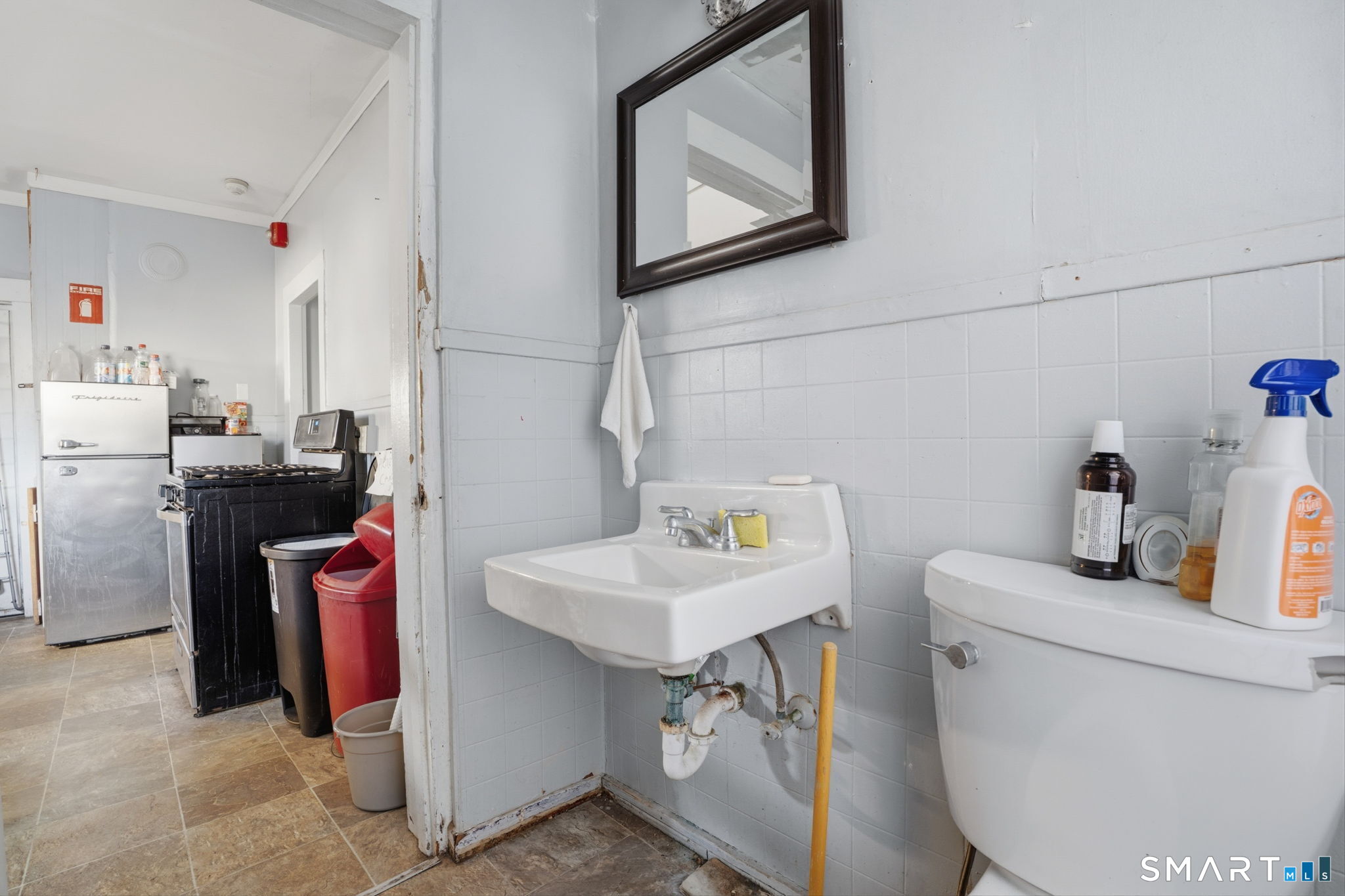 49 Birch Street Manchester, CT 06040 - Photo 8 of 30 a bathroom with a sink toilet and a mirror