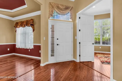 a kitchen with stainless steel appliances granite countertop a refrigerator a stove a sink and a microwave