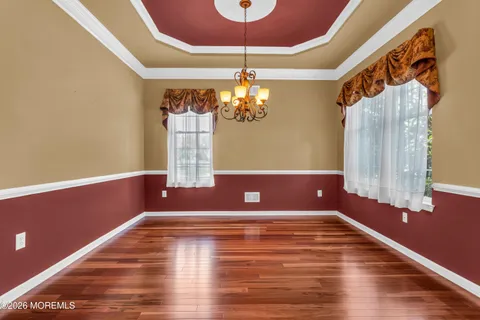a kitchen with granite countertop wooden cabinets a stove top oven a sink and dishwasher
