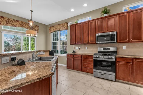 a living room with furniture fireplace and a flat screen tv