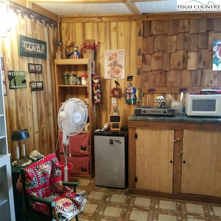 1655 Tucker Road Lansing, NC 28643 - Photo 2 of 15 a kitchen with a refrigerator and a stove