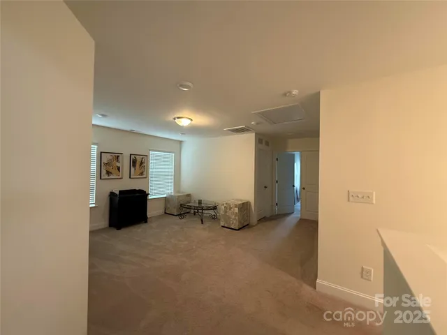 a view of room with window and furniture