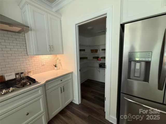 a swimming pool with some trees and big trees