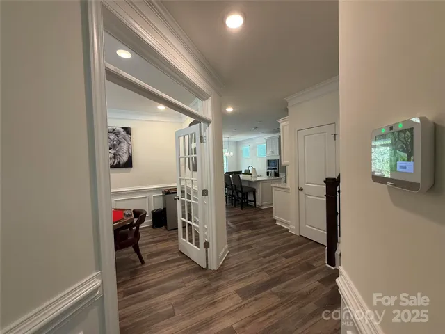 a view of living room with furniture and wooden floor