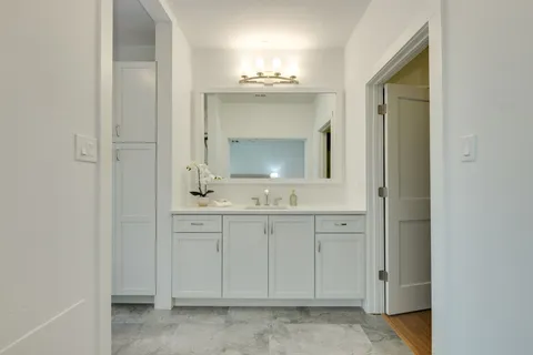 a bathroom with a sink and a mirror