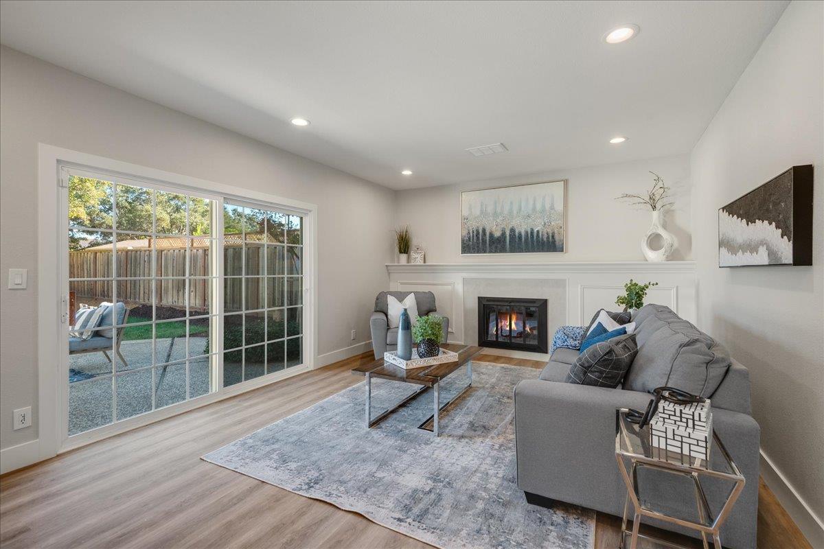 7106 Brooktree Way San Jose, CA 95120 - Photo 11 of 31 a living room with furniture a window and a fireplace