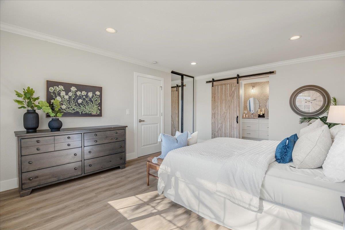 7106 Brooktree Way San Jose, CA 95120 - Photo 19 of 31 a bedroom with a bed and a chandelier