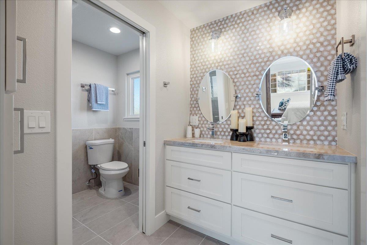 7106 Brooktree Way San Jose, CA 95120 - Photo 20 of 31 a bathroom with a toilet sink and mirror