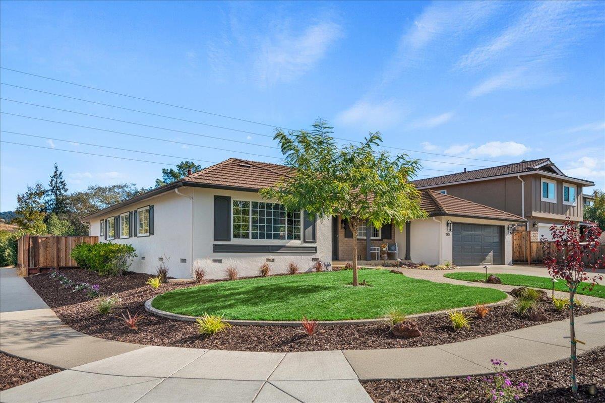 7106 Brooktree Way San Jose, CA 95120 - Photo 2 of 31 a front view of a house with a garden and plants