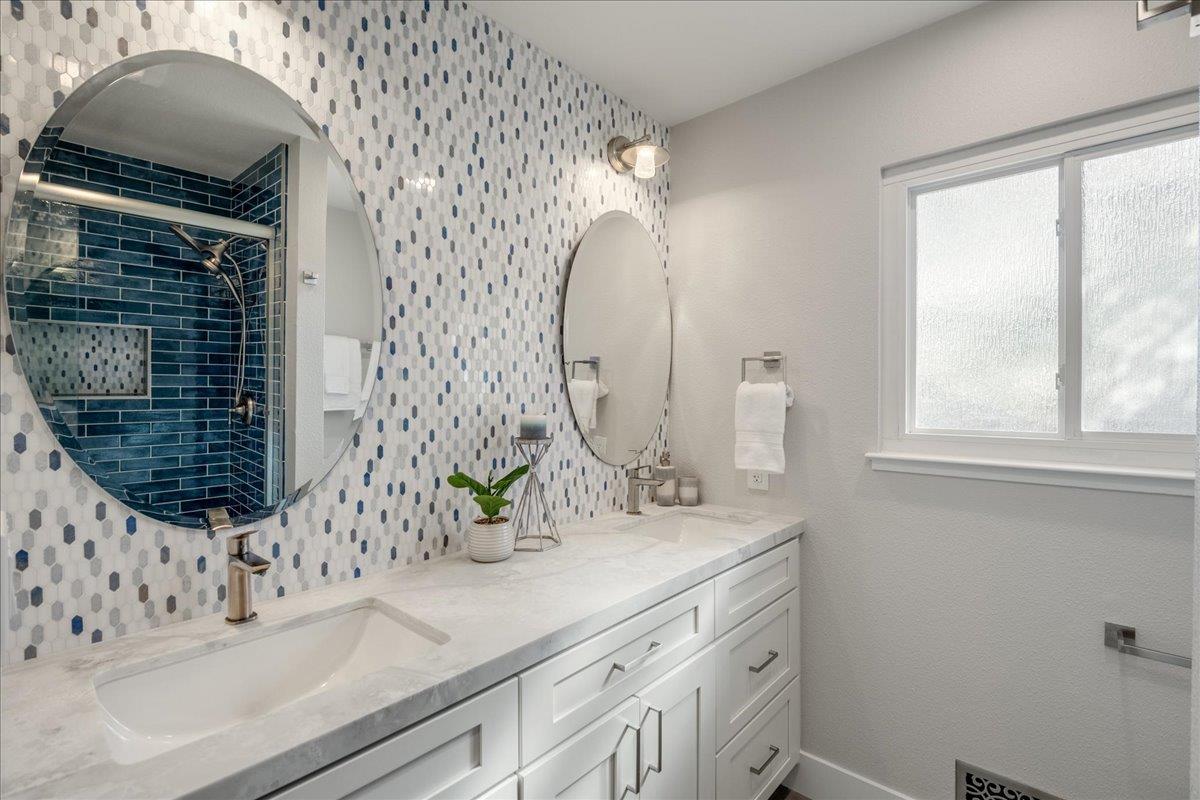 7106 Brooktree Way San Jose, CA 95120 - Photo 25 of 31 a bathroom with a sink and a mirror