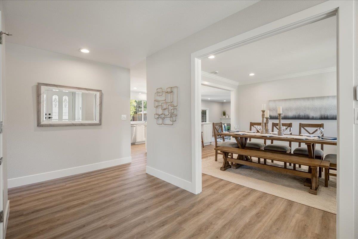 7106 Brooktree Way San Jose, CA 95120 - Photo 7 of 31 a living room with stainless steel appliances kitchen island hardwood floor and a window