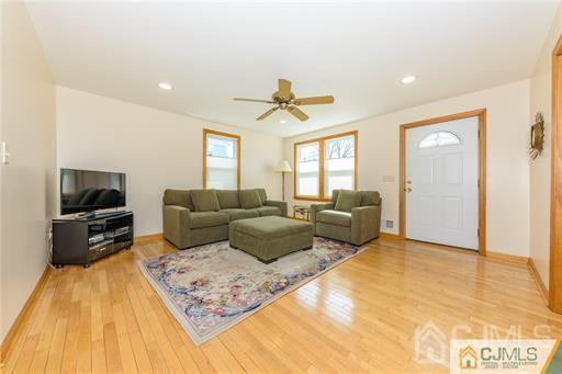 304 John Street Middlesex, NJ 08846 - Photo 13 of 25 a living room with furniture and a flat screen tv