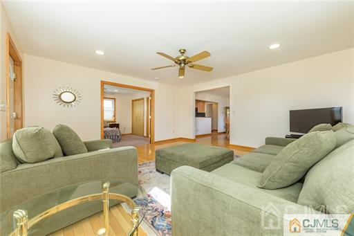 304 John Street Middlesex, NJ 08846 - Photo 14 of 25 a living room with furniture and a large window