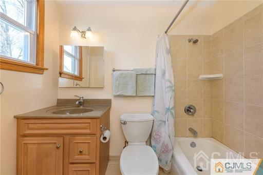 304 John Street Middlesex, NJ 08846 - Photo 23 of 25 a bathroom with a granite countertop toilet sink and mirror