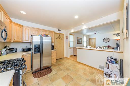 304 John Street Middlesex, NJ 08846 - Photo 4 of 25 a kitchen with refrigerator and window