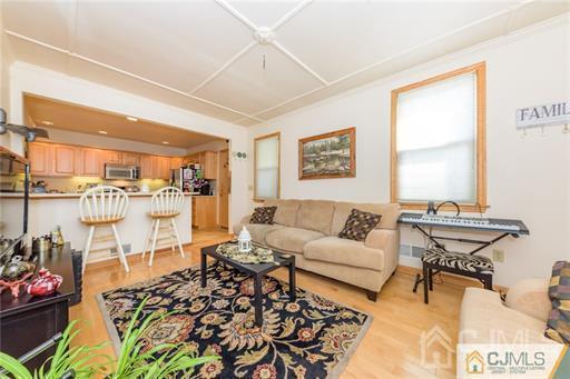 304 John Street Middlesex, NJ 08846 - Photo 7 of 25 a living room with furniture and a table