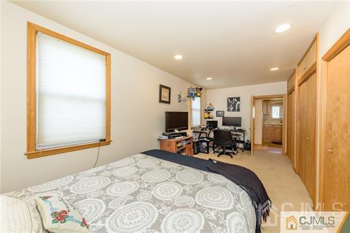 304 John Street Middlesex, NJ 08846 - Photo 10 of 25 a bed room with a bed and a chair