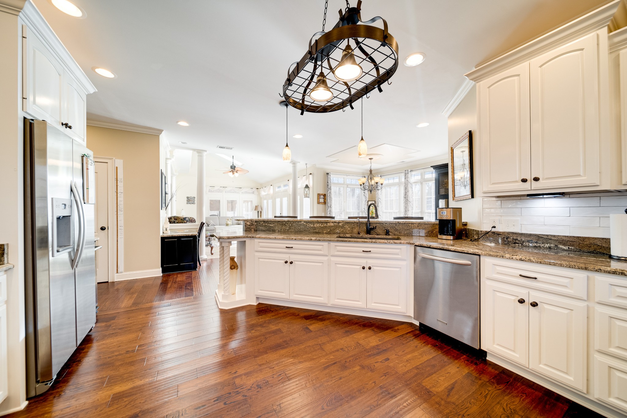 236 Raymond Hodges Road Cottontown, TN 37048 - Photo 21 of 37 a large kitchen with stainless steel appliances kitchen island a large counter space and wooden floor