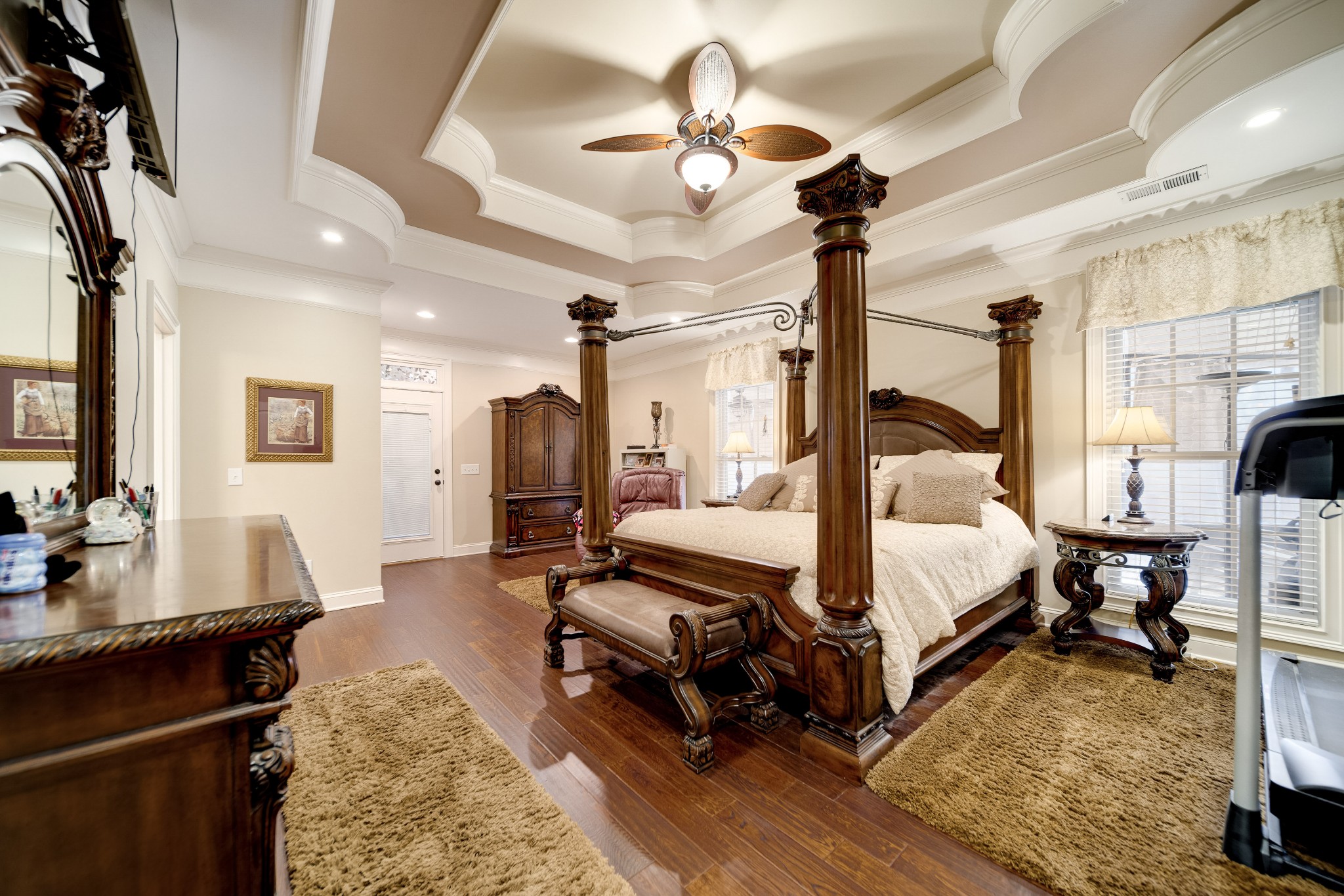 236 Raymond Hodges Road Cottontown, TN 37048 - Photo 30 of 37 a spacious bedroom with a bed a table and wooden floor