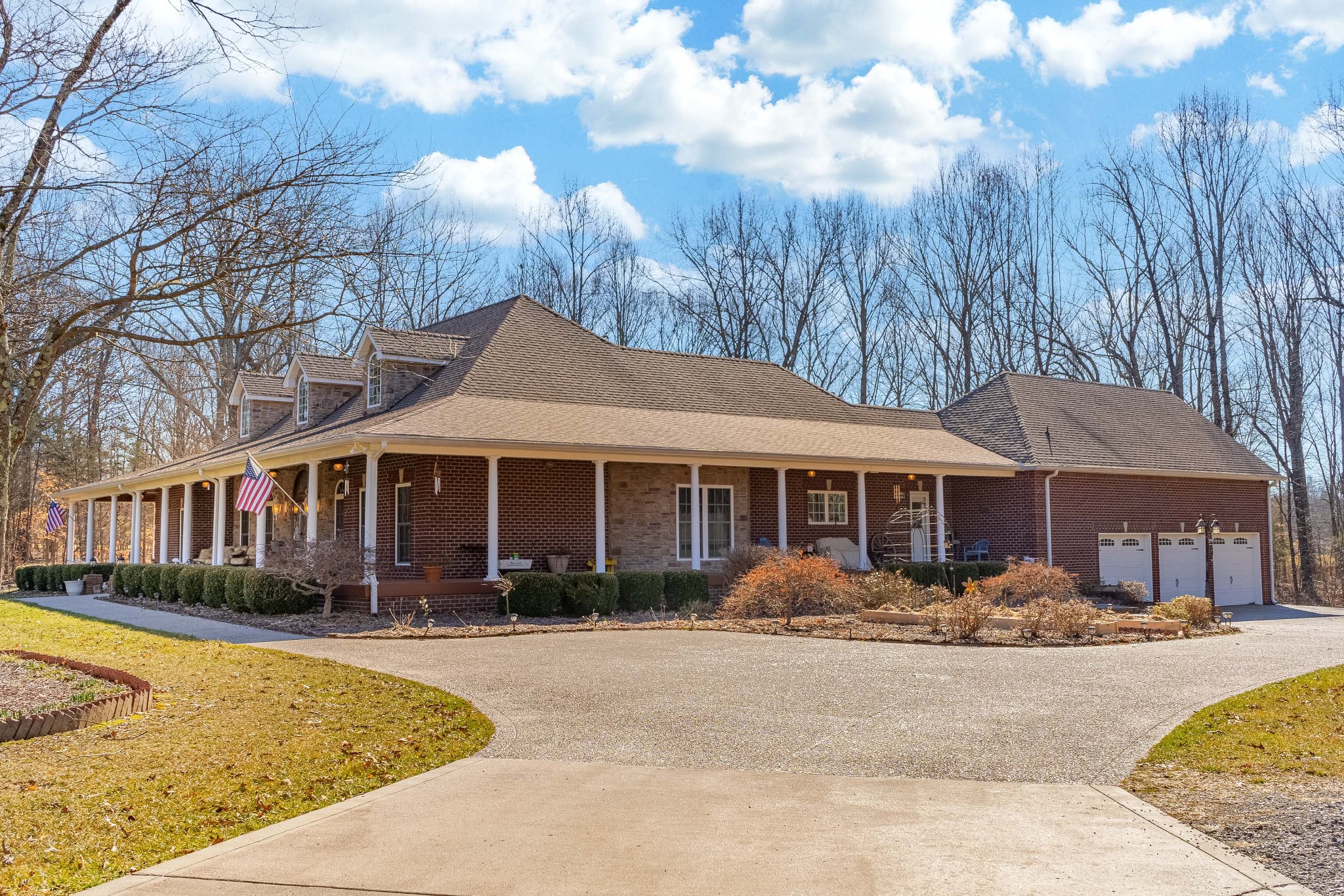 236 Raymond Hodges Road Cottontown, TN 37048 - Photo 4 of 37 a front view of a house with swimming pool and porch