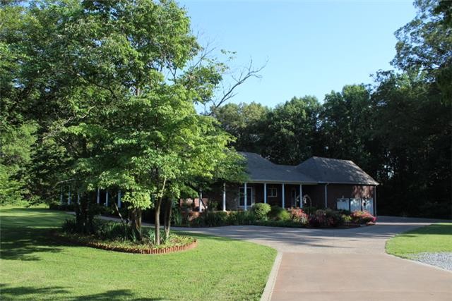 236 Raymond Hodges Road Cottontown, TN 37048 - Photo 34 of 37 a front view of a house with a yard