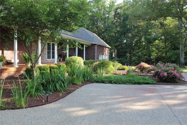 236 Raymond Hodges Road Cottontown, TN 37048 - Photo 35 of 37 a front view of a house with garden