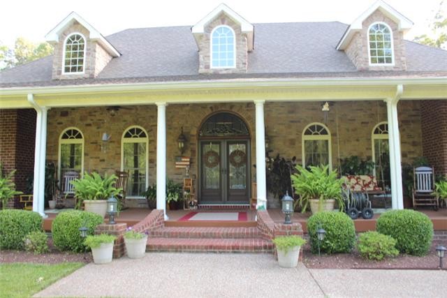 236 Raymond Hodges Road Cottontown, TN 37048 - Photo 37 of 37 a front view of a building with garden