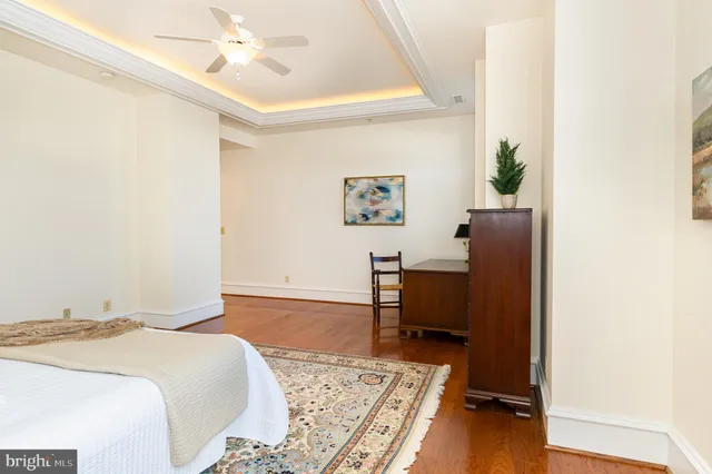 a bedroom with two beds and a chandelier