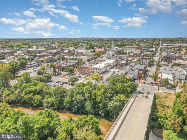 an aerial view of residential building and trees around