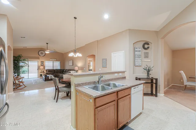 a kitchen with center island table and chairs in it