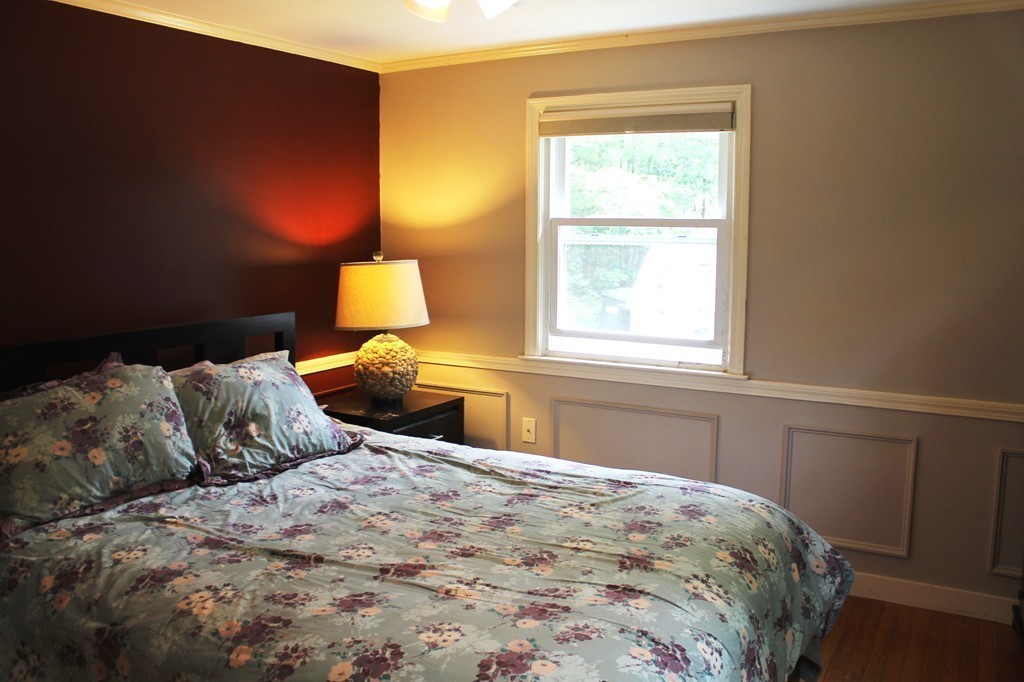 230 West Sutton Road Sutton, MA 01590 - Photo 19 of 28 a bedroom with a bed and window